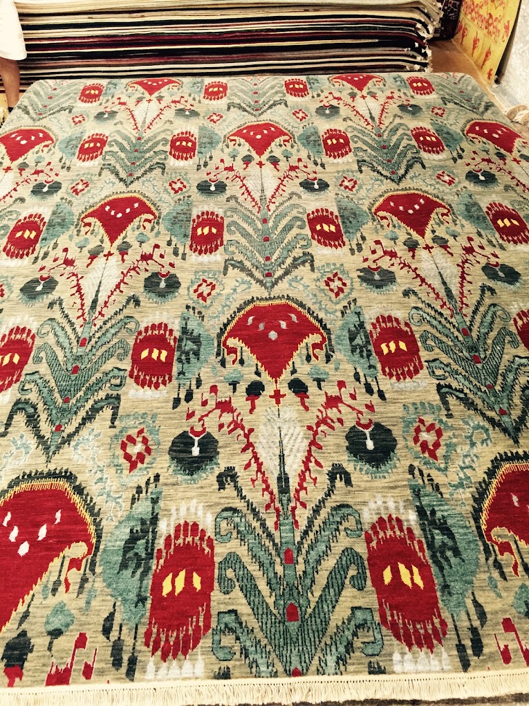 Green and red botanical rug from the Diamond Rug Gallery collection