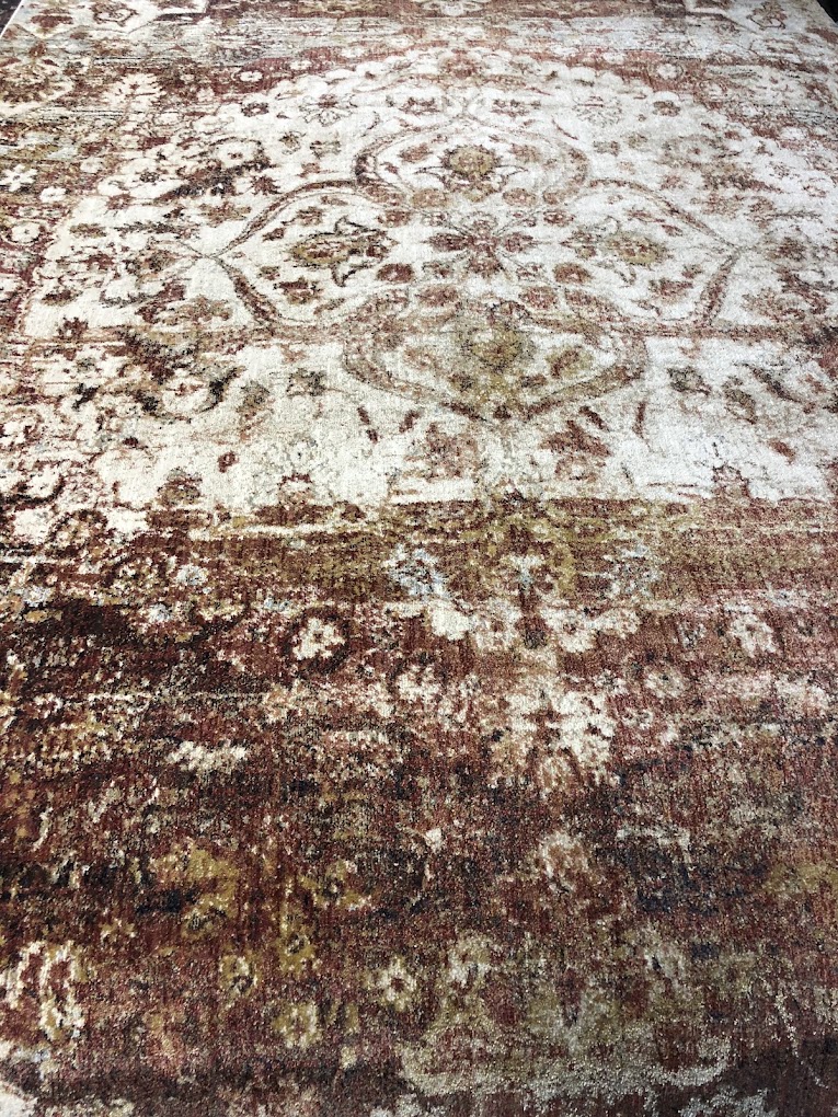 Neutral rug with subtle traditional patterning