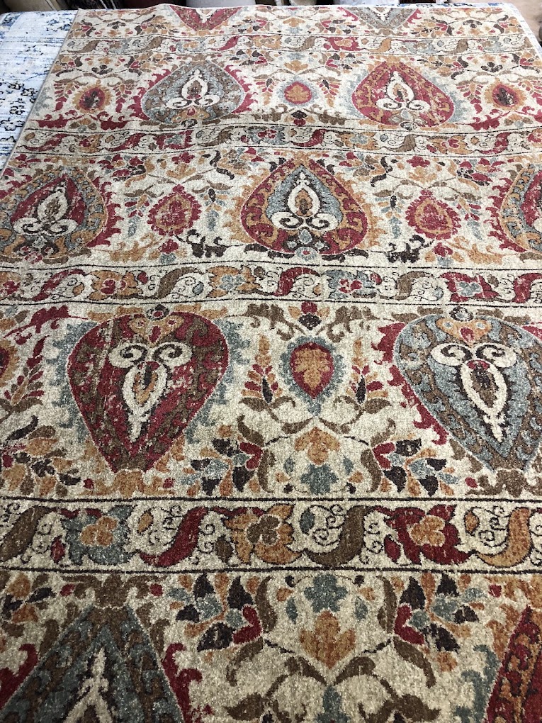 Detailed rug with red and blue paisley motifs