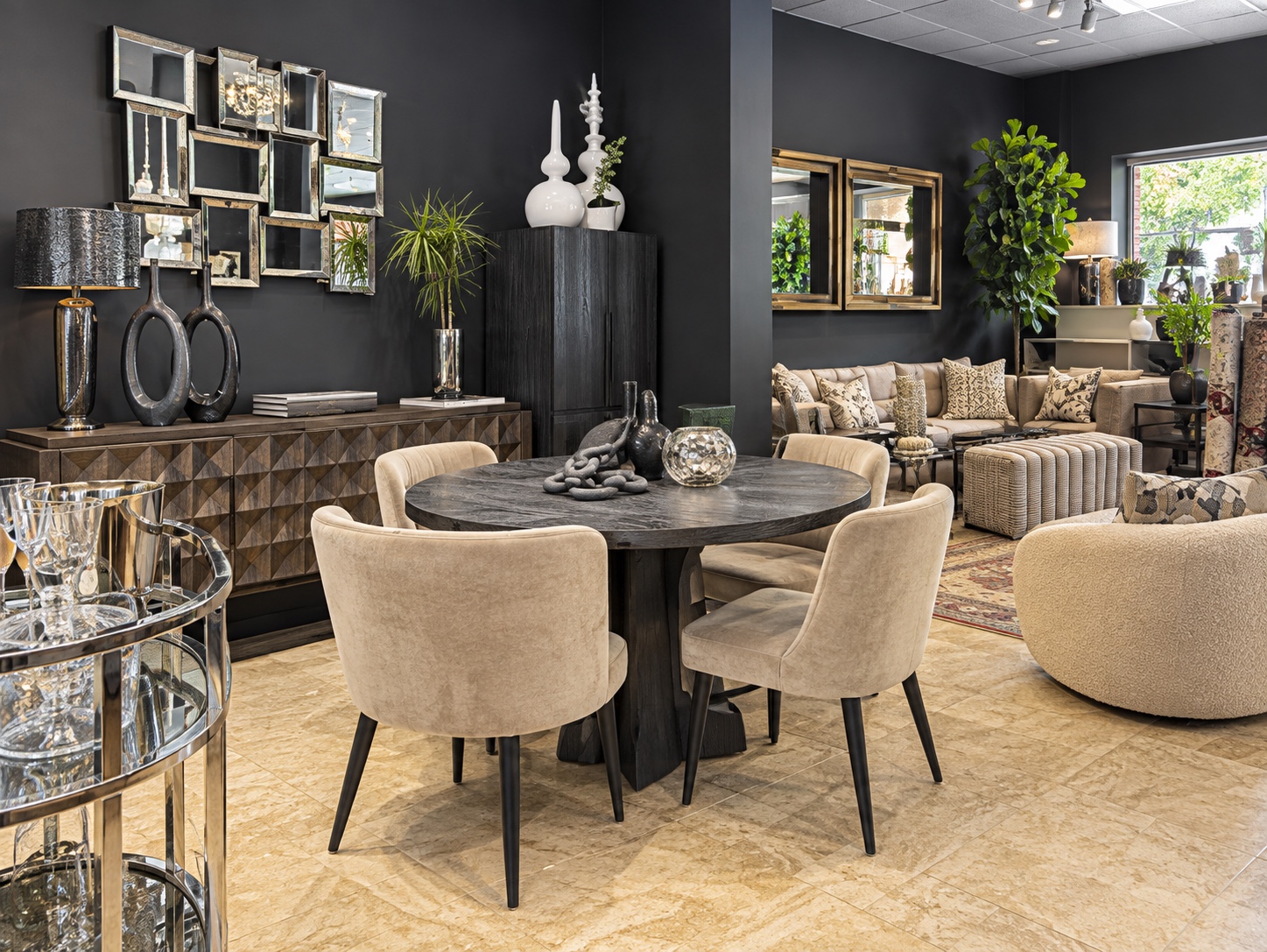 Current College Park showroom with a dining display, designer furniture, and coordinated rugs